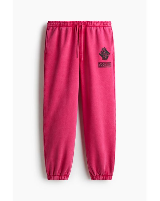 H&M Sweatpants mit Printmotiv in Relaxed Fit in Pink für Herren