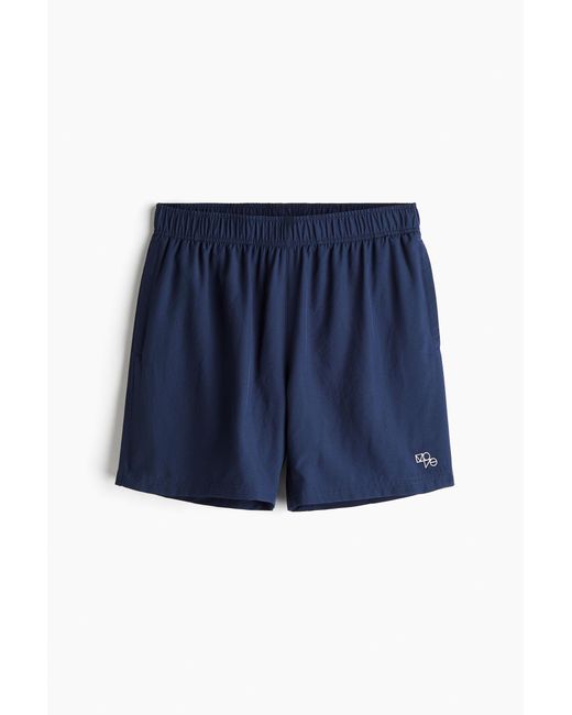Short de sport tissé DryMoveTM avec poches H&M pour homme en coloris Blue