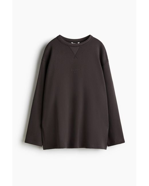 H&M Black Sweatshirt mit Textmotiv