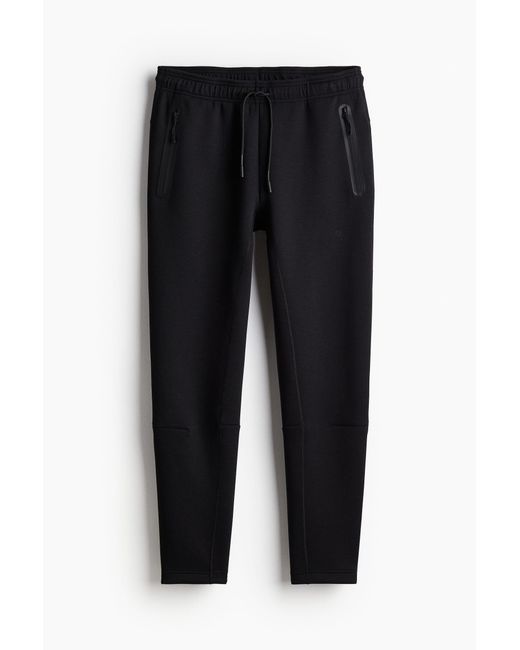 Pantalon jogger de sport effilé DryMoveTM H&M pour homme en coloris Black