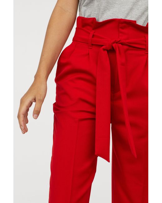 High waist belted paperbag trousers in red  Szua Store