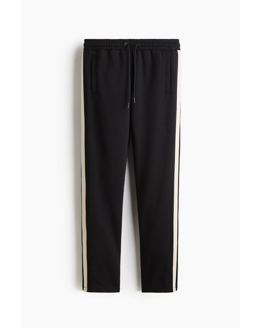 H&M Trainingshose mit DryMoveTM in Regular Fit in Black für Herren