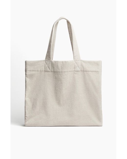 H&M Natural Strandtasche aus Baumwollfrottee