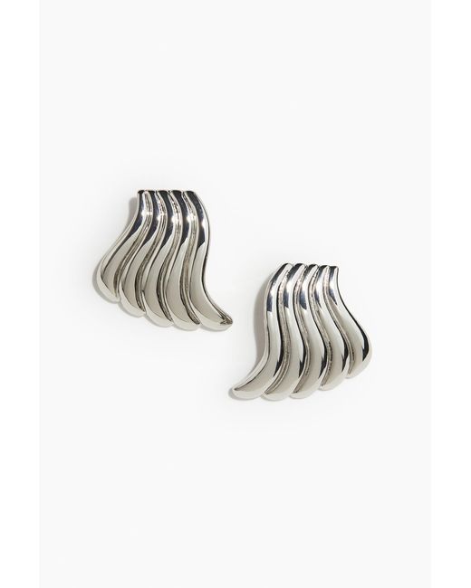 H&M Metallic Ohrringe im Wirbeldesign