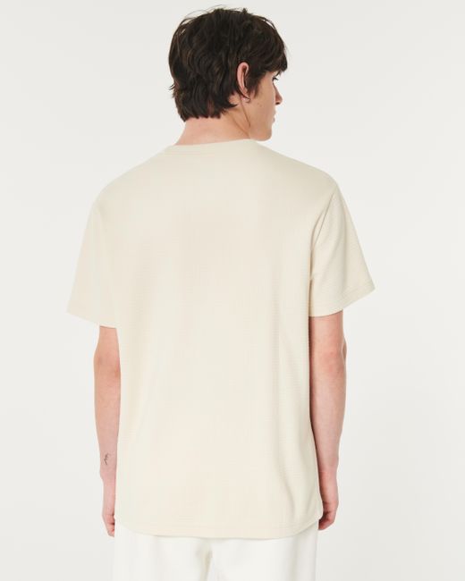 Hollister Lässiges, strukturiertes T-Shirt mit Rundhalsausschnitt und Symbol in Natural für Herren