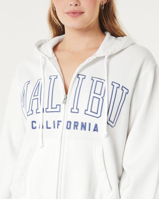 Hollister White Lässiger Hoodie mit Malibu California-Grafik und Reißverschluss