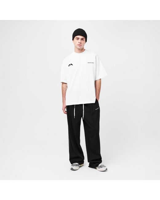 MKI Miyuki-Zoku Black Wide Fit Open Hem Woven Tracksuit Joggers for men