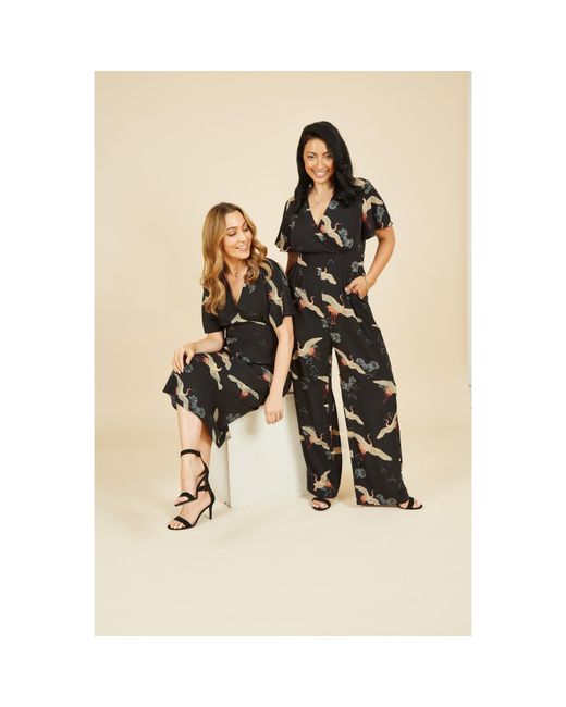 Yumi' White Crane Print Jumpsuit