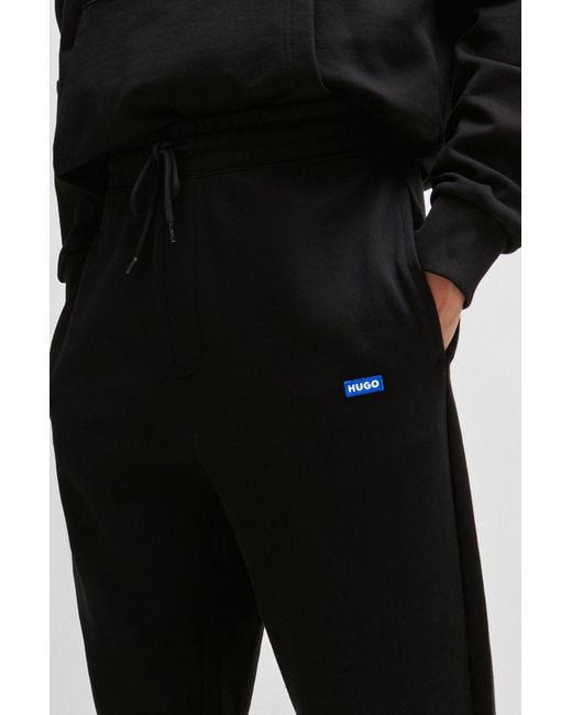 HUGO Black Cotton-terry Tracksuit Bottoms With Blue Logo Patch for men