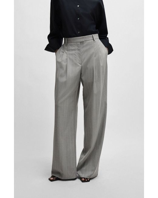 Pantalon large NAOMI x en laine vierge à rayures tennis Boss en coloris Black