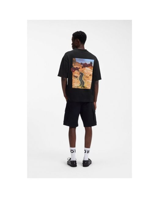 HUGO Black Oversized-Fit Cotton T-Shirt With Biker And Roses Graphic for men