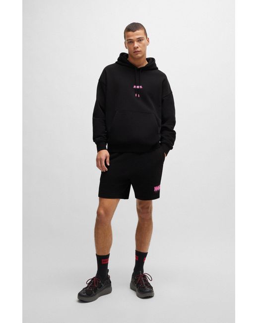 HUGO Black Cotton-terry Oversized-fit Hoodie With Seasonal Logos for men