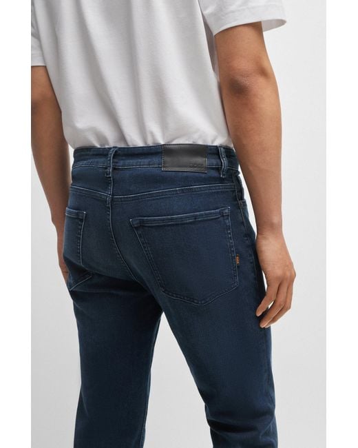 BOSS - Regular-fit jeans in dark-blue comfort-stretch denim