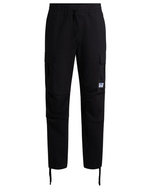 Pantalon cargo Relaxed Fit en coton structuré HUGO pour homme en coloris Black