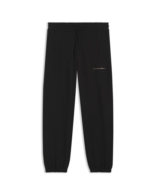 HUGO Black Relaxed-Fit Cotton Trousers With Streetwear Logo for men
