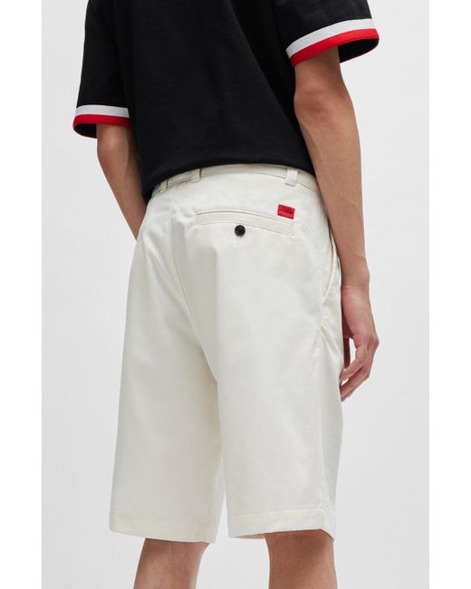 HUGO Regular-Fit Shorts mit schmalem Beinverlauf und geknöpften Taschen in White für Herren