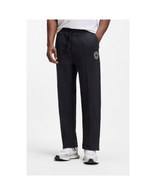 Boss Blue Cotton-Blend Tracksuit Bottoms With Tennis-Themed Logo for men