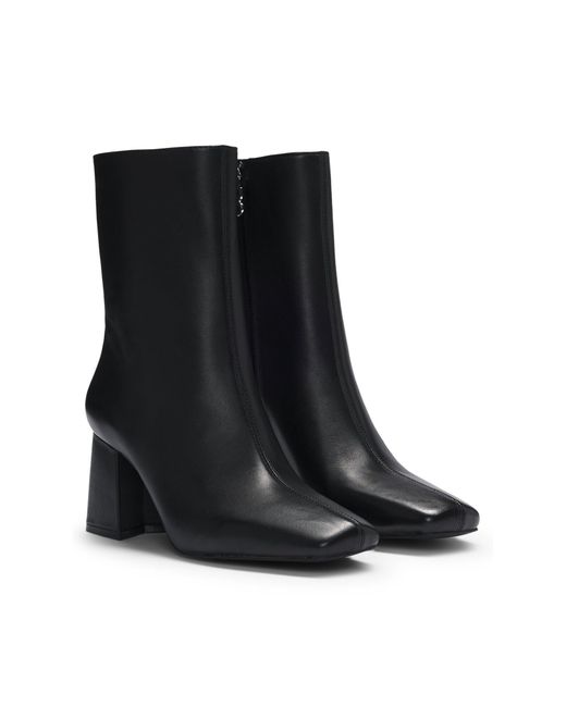 Bottines en similicuir à talon bottier HUGO en coloris Black