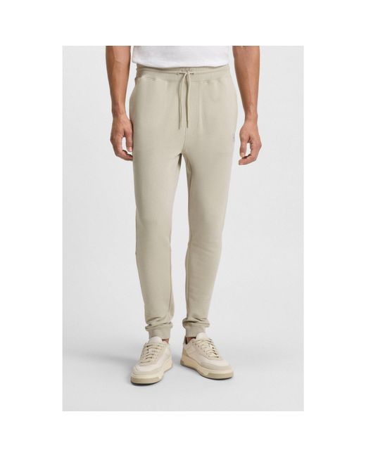 Boss Natural Cotton-Terry Tracksuit Bottoms With Logo Patch for men