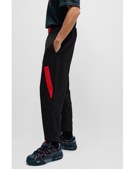 HUGO Black Relaxed-fit Tracksuit Bottoms With Red Logo Tape for men