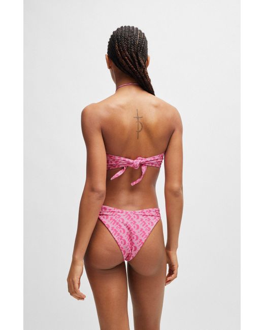 Bas de bikini brésilien à logo imprimé répété HUGO en coloris Pink