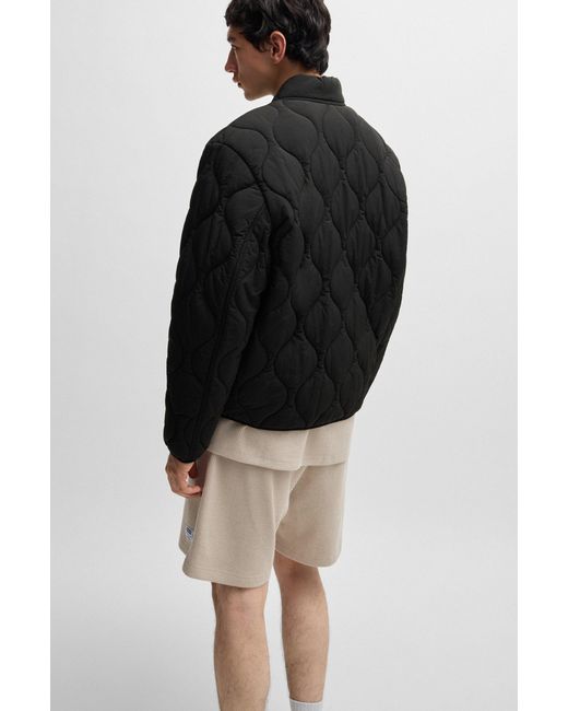 HUGO Black Water-Repellent Quilted Jacket With Logo Badge for men