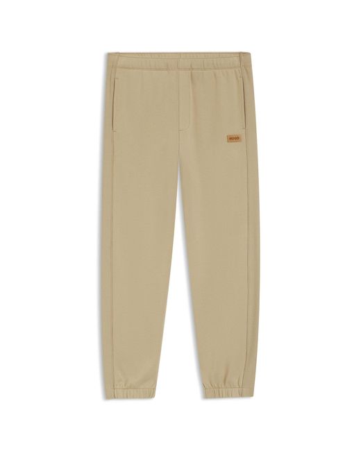 HUGO Natural Cotton-Terry Tracksuit Bottoms With Logo Badge for men