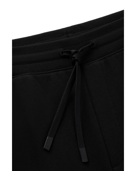 Bas de survêtement en molleton de coton avec logo imprimé HUGO pour homme en coloris Black
