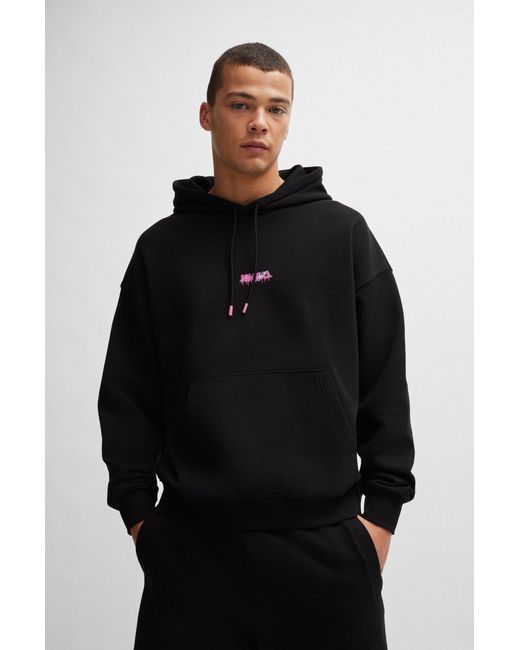 HUGO Black Cotton-terry Oversized-fit Hoodie With Seasonal Logos for men
