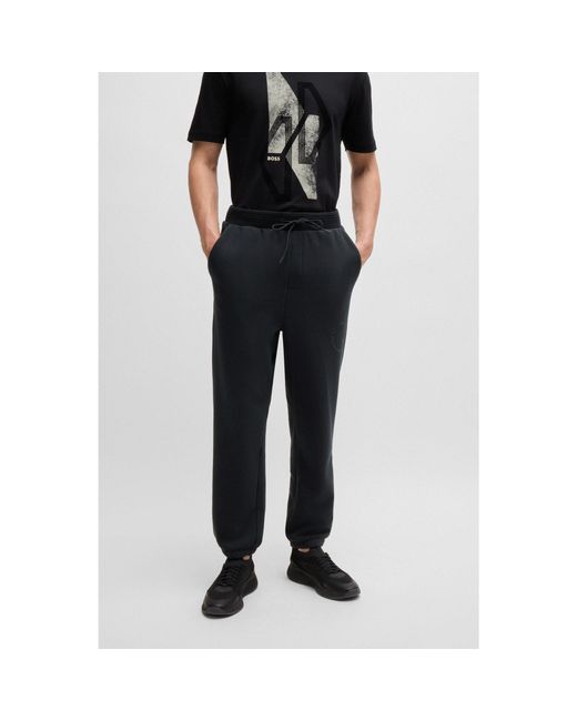 BOSS Relaxed Fit Tracksuit Bottoms With Tonal Artwork in Black for Men Lyst UK