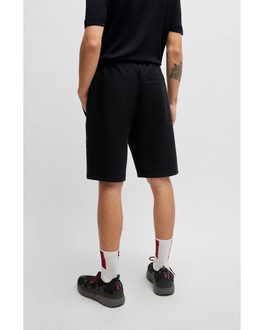 HUGO Relaxed-Fit Shorts aus Stretch-Baumwolle mit Stack-Logo in Black für Herren