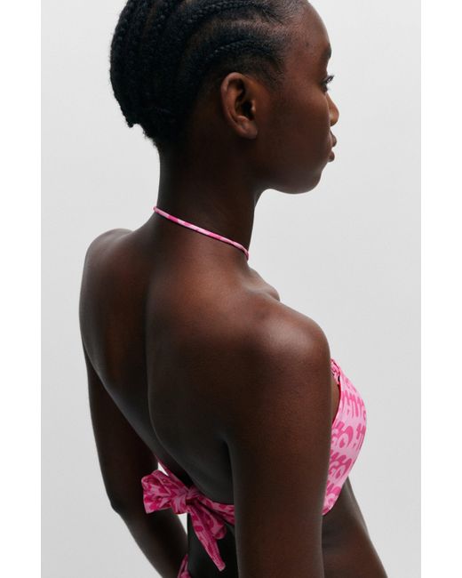 Haut de bikini bandeau à logo imprimé répété HUGO en coloris Pink