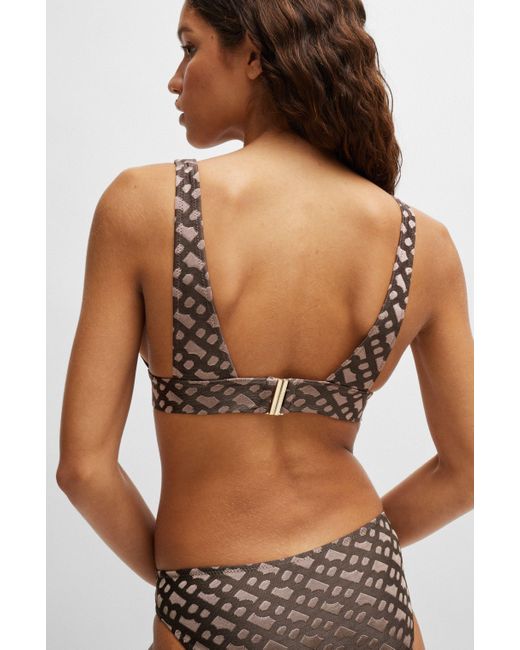 Brassière de bikini en jacquard monogramme avec garniture logo Boss en coloris Gray