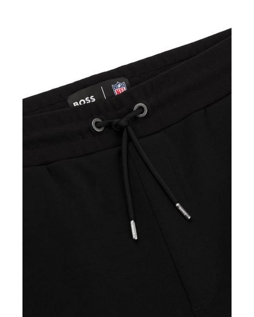 Short x NFL en coton mélangé avec patch logoté Boss pour homme en coloris Black
