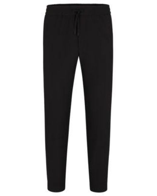 Chino Tapered Fit en tissu quadri-extensible facile à repasser Boss pour homme en coloris Black