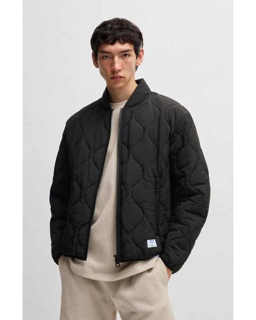 HUGO Black Water-Repellent Quilted Jacket With Logo Badge for men