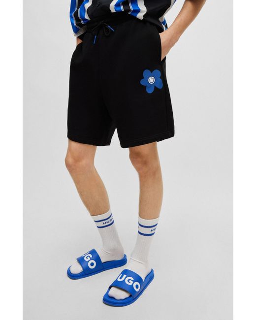 HUGO Shorts aus Baumwoll-Terry mit Blumen-Logo-Artwork in Black für Herren