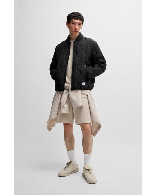 HUGO Black Water-Repellent Quilted Jacket With Logo Badge for men