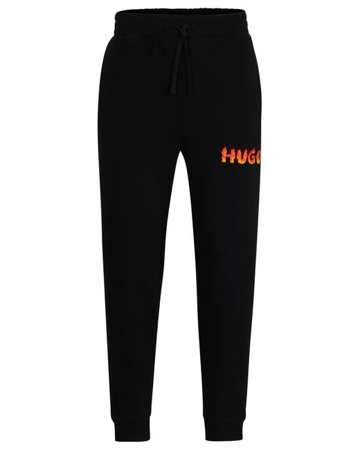 Bas de survêtement en molleton de coton avec logo flammes en relief HUGO pour homme en coloris Black