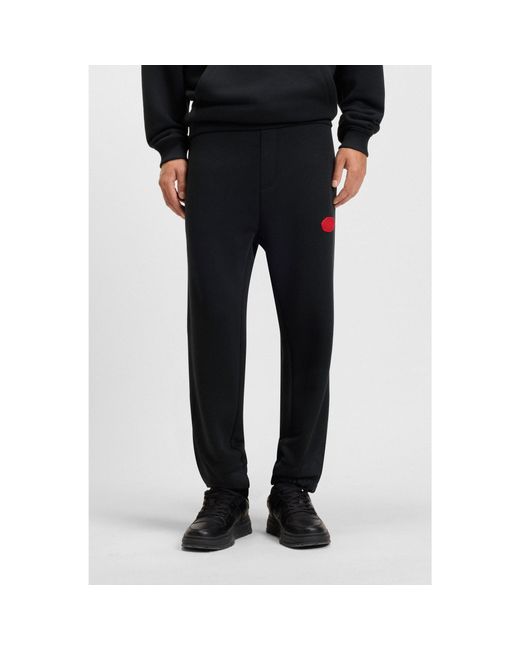 HUGO Black Cotton-Blend Tracksuit Bottoms With Waxed-Stamp Logo for men