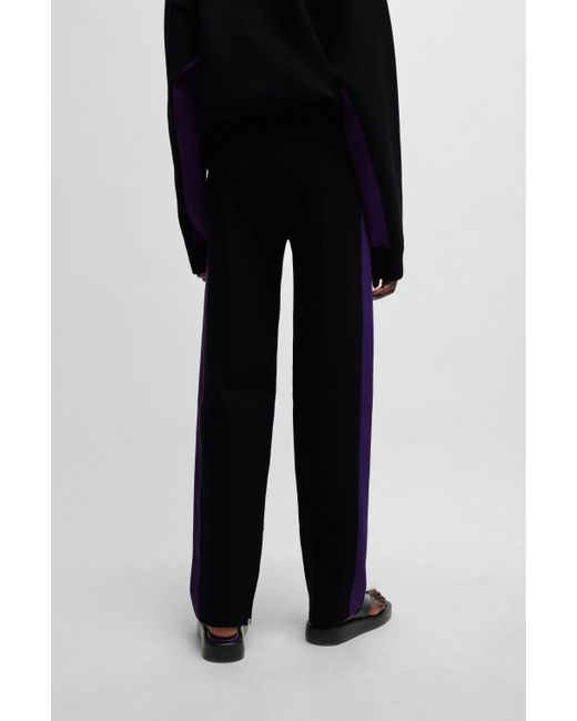 Pantalon en maille NAOMI x à rayures contrastantes sur les côtés Boss en coloris Black