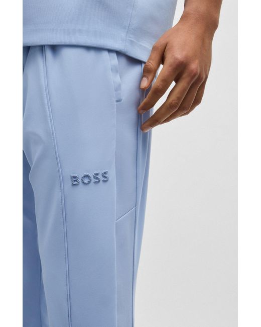Boss Blue Relaxed-fit Trousers With Double-monogram Badge for men