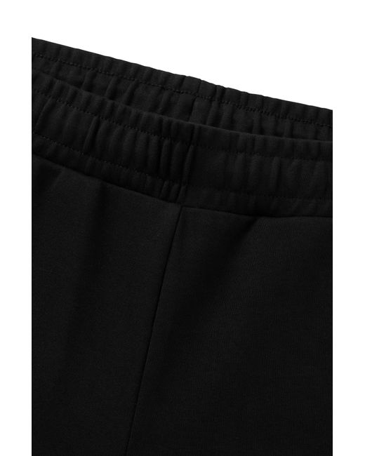 HUGO Black Flared Tracksuit Bottoms In Stretch Cotton With Logo Tape