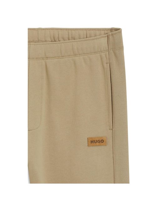 HUGO Natural Cotton-Terry Tracksuit Bottoms With Logo Badge for men