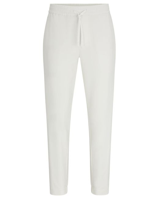 Chino Tapered Fit en tissu quadri-extensible facile à repasser Boss pour homme en coloris White