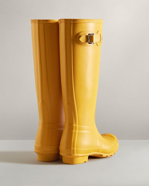 yellow rubber rain boots