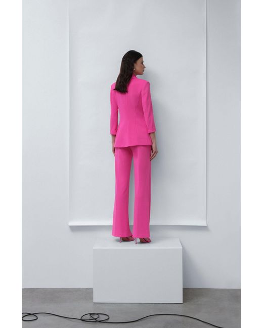 Pantalon évasé à poches verticales et plis marqués Imperial en coloris Pink