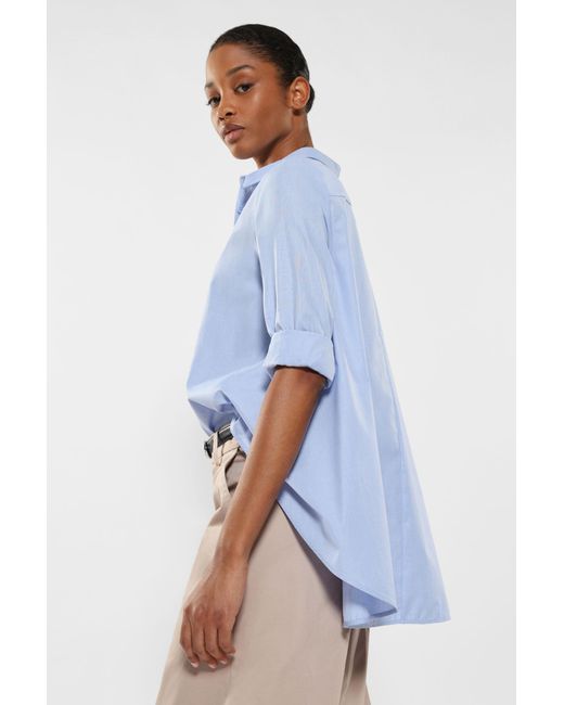 Chemise asymétrique femme sale