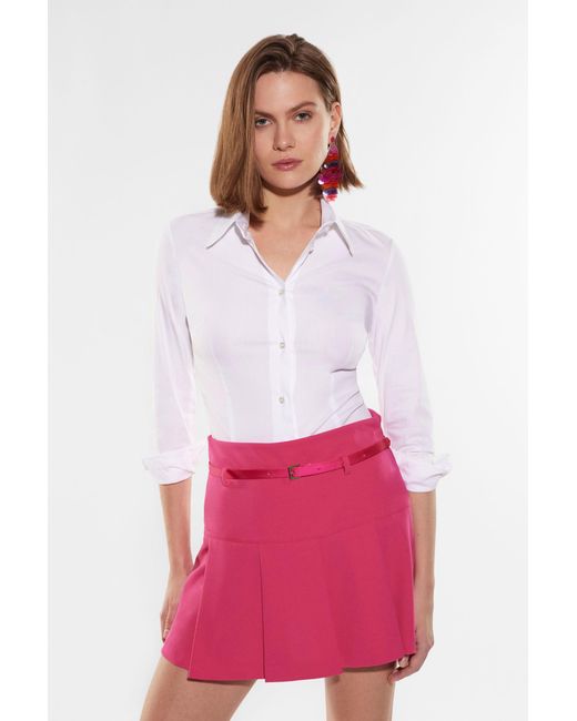 Mini-jupe corolle unie avec ceinture fine Imperial en coloris Pink