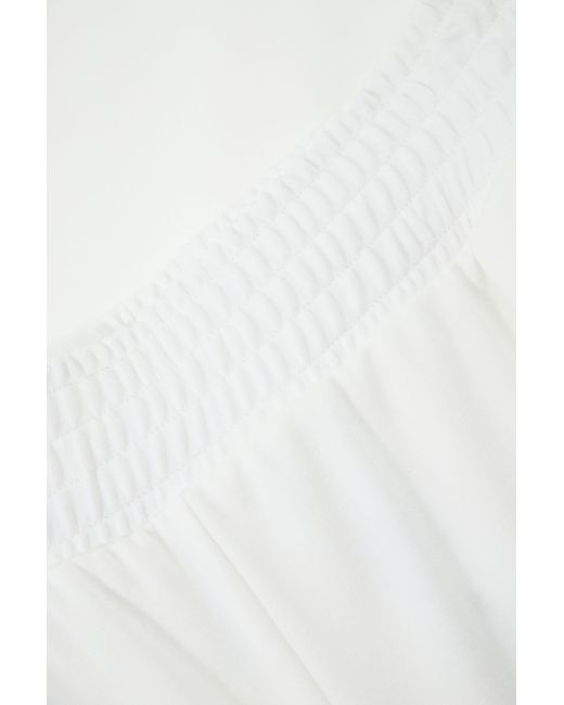 Pantalon de jogging style palazzo à poches verticales Imperial en coloris White